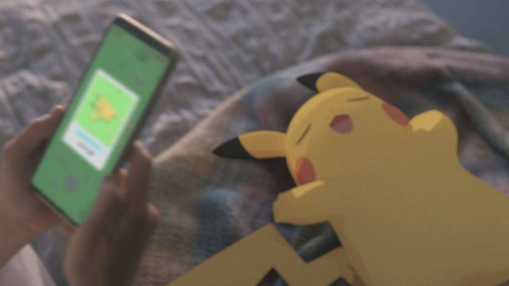 Sleepy Pikachu and phone